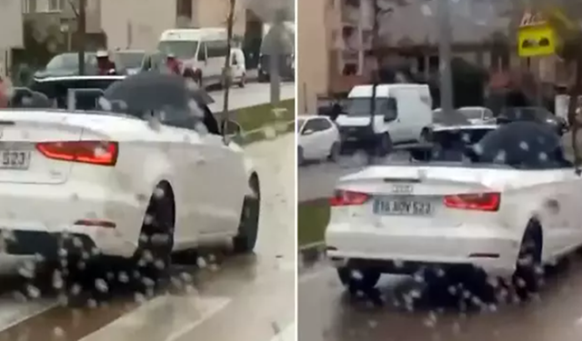 Milyonluk arabasında ıslanmamak için bakın ne yaptı